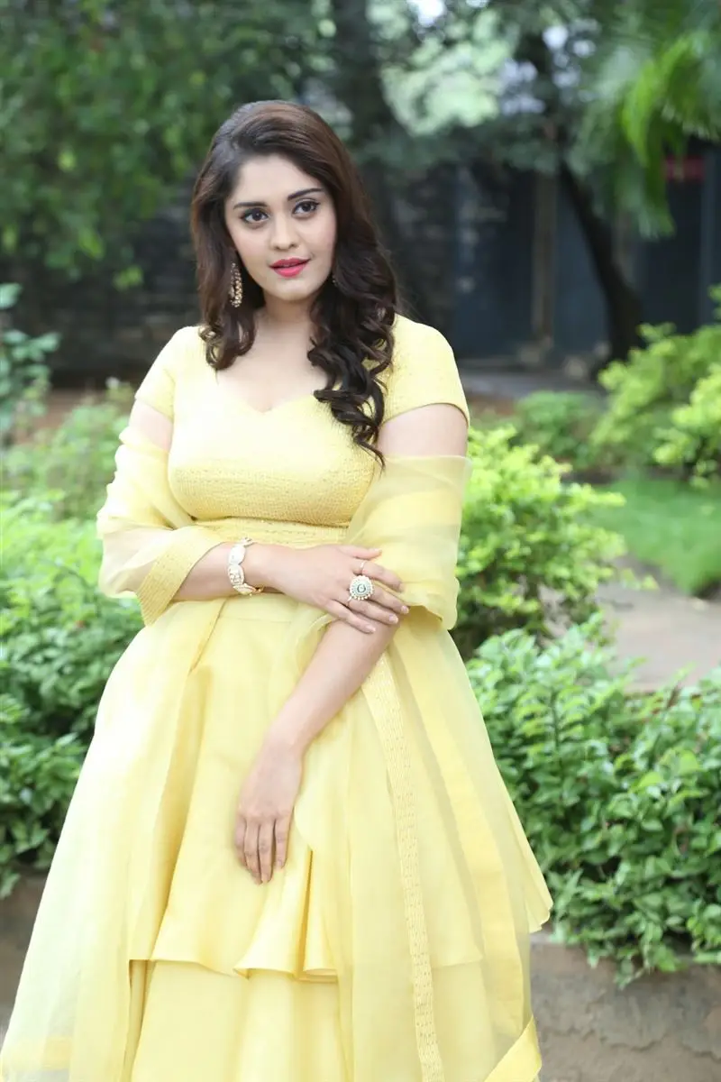 TELUGU GIRL SURBHI PURANIK PHOTOSHOOT IN YELLOW GOWN 4